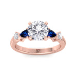 2.57ct-t-w-round-cut-diamond-engagement-ring-with-blue-sapphire-pear-shape-sidestones-in-solid-rose-gold
