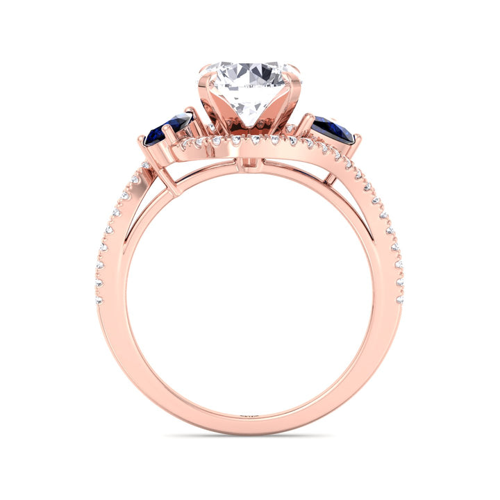 round-cut-diamond-engagement-ring-with-halo-and-blue-sapphire-pear-shape-sidestones-in-solid-rose-gold
