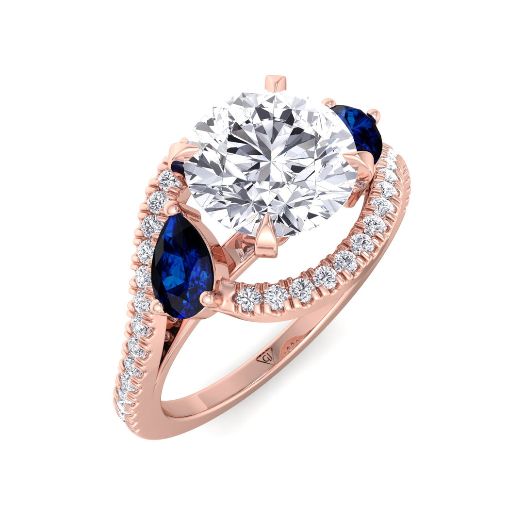 2.85ctw-round-cut-diamond-engagement-ring-with-halo-and-blue-sapphire-pear-shape-sidestones-in-solid-rose-gold