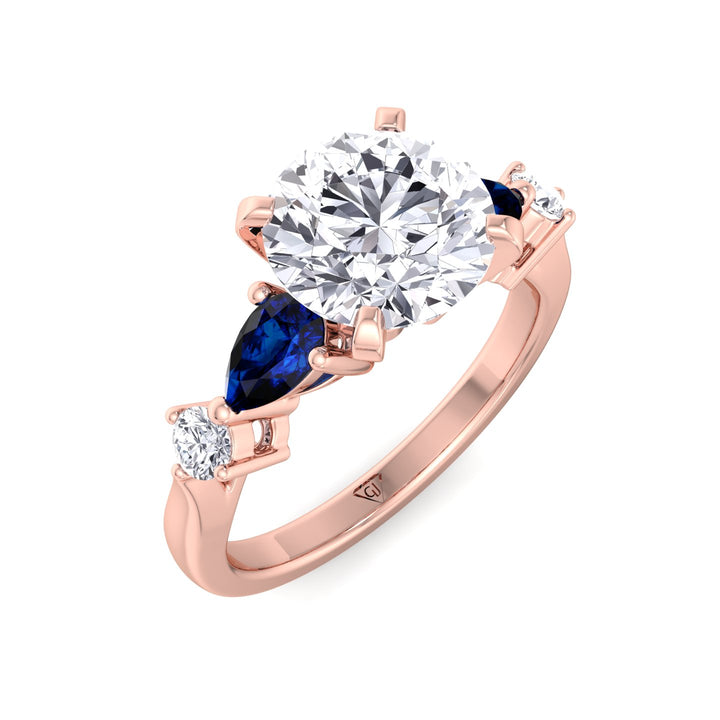  2.57ctw-round-cut-diamond-engagement-ring-with-blue-sapphire-pear-shape-sidestones-solid-rose-gold