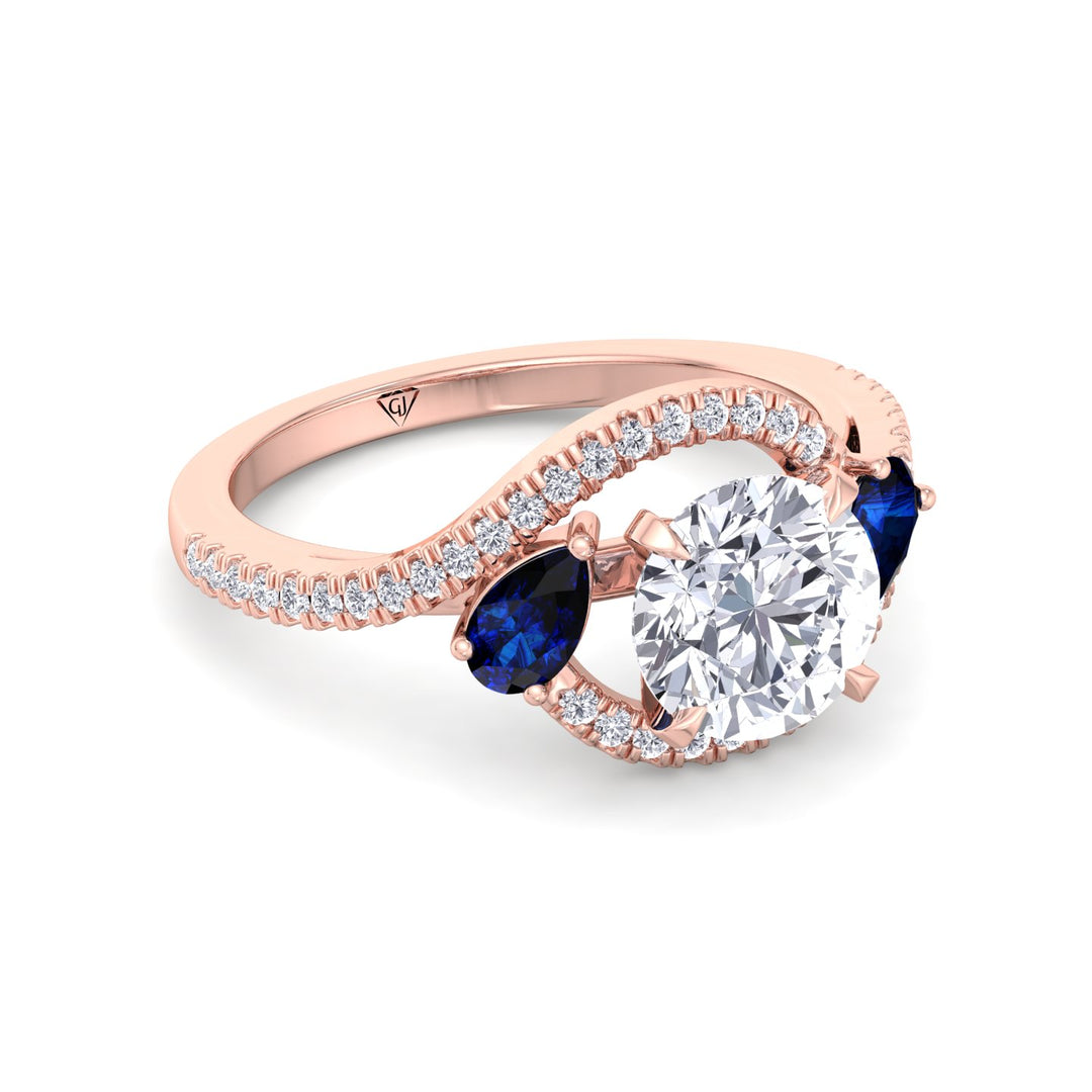 2.85ctw-round-cut-diamond-engagement-ring-with-halo-blue-sapphire-pear-shape-sidestones-in-rose-gold