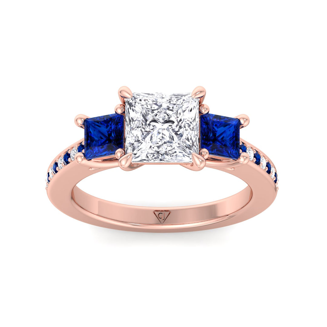 3.20-c-t-w-princess-cut-diamond-engagement-ring-with-blue-sapphire-sidestones-in-rose-gold 