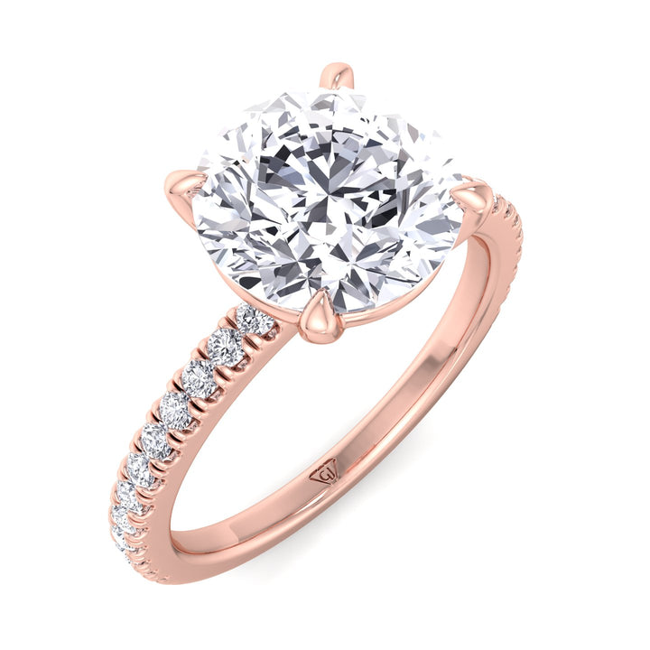 round-cut-diamond-ring-with-sidestones-in-solid-rose-gold