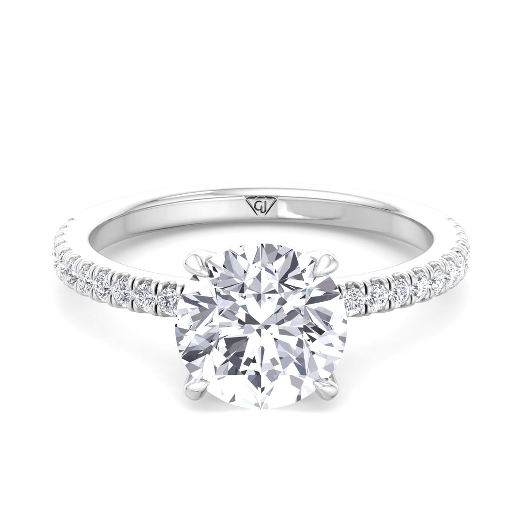 round-cut-diamond-ring-with-sidestones-in-solid-white-gold