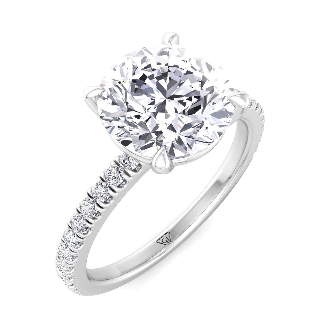 round-cut-diamond-ring-with-sidestones-solid-white-gold