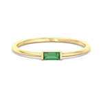  dainty-green-emerald-baguette-solitaire-stackable-ring-in-yellow-gold