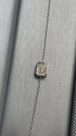 Bezel set natural diamond bracelet with emerald cut stones