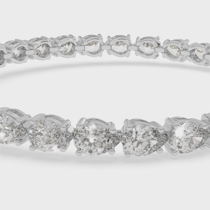 pear-shape-prong-setting-east-to-west-diamond-tennis-bracelet-in-solid-white-gold